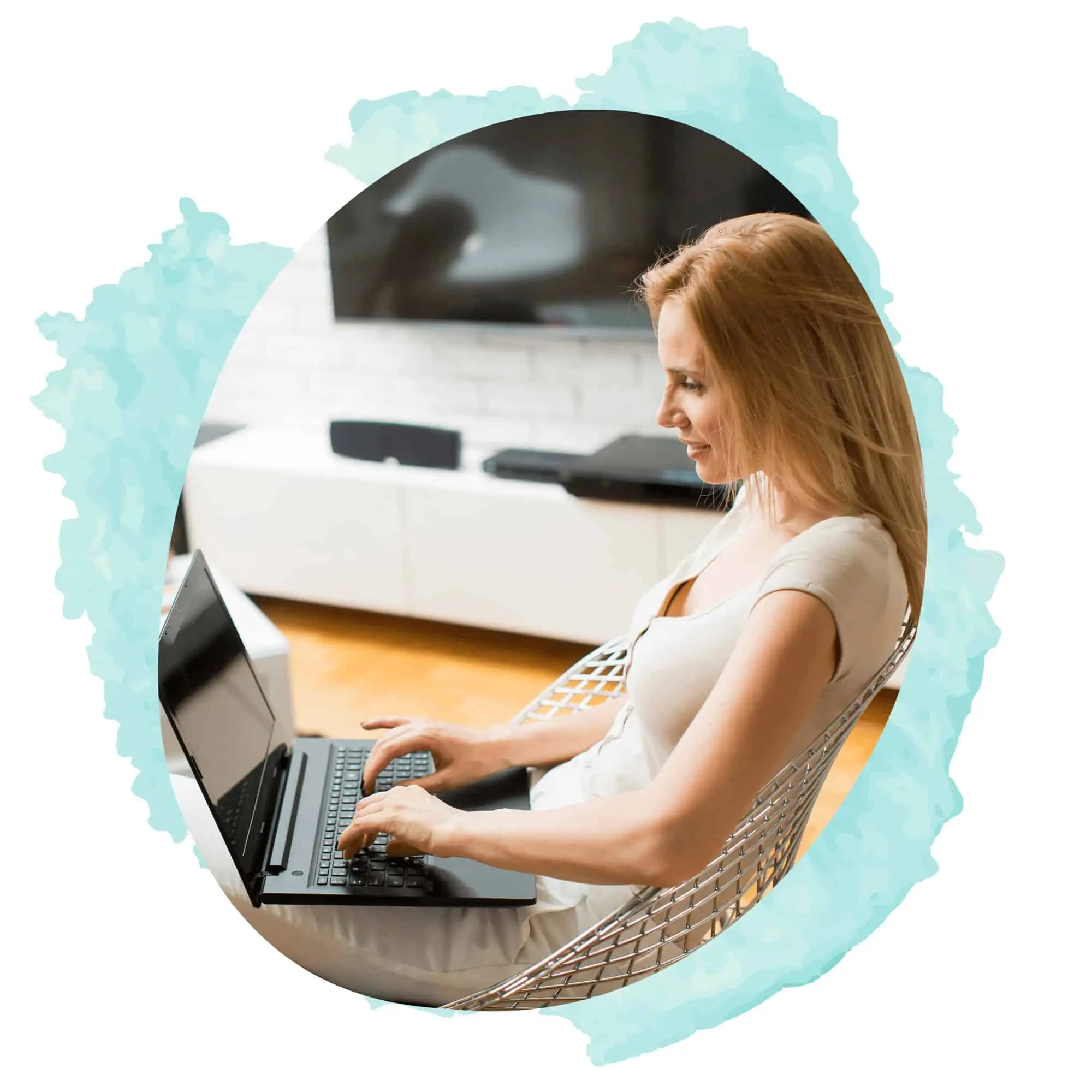 Woman sitting in a chair at laptop