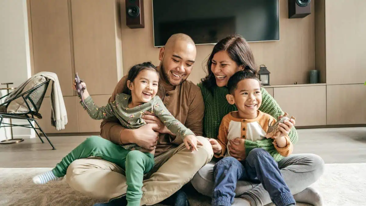 A photo of a happy family in their living room