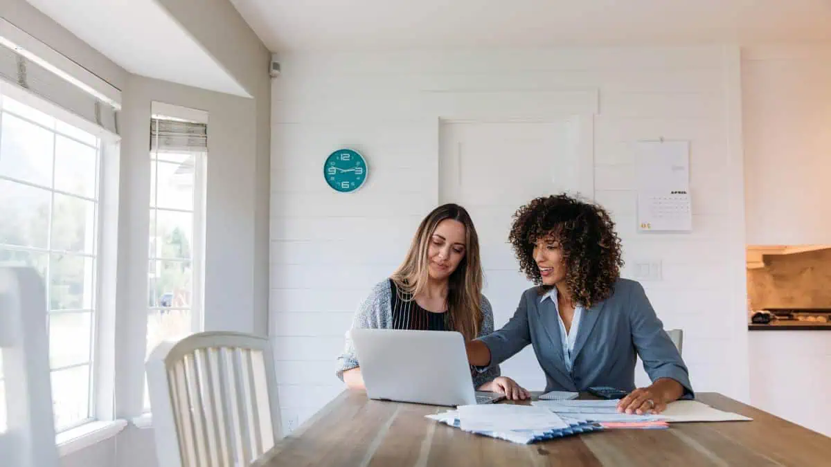 A photo of a woman seeking financial advice from a professional