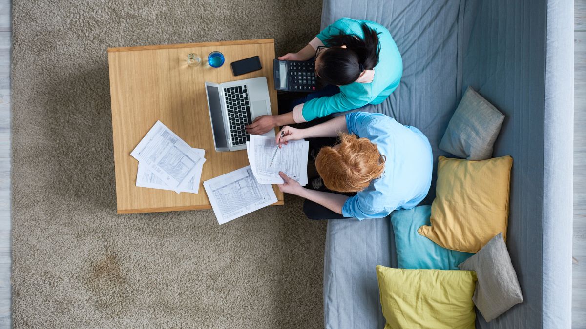 Two people preparing the documents for their tax